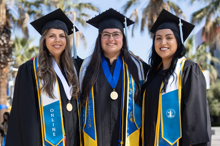 SJSU Online graduates in their regalia.