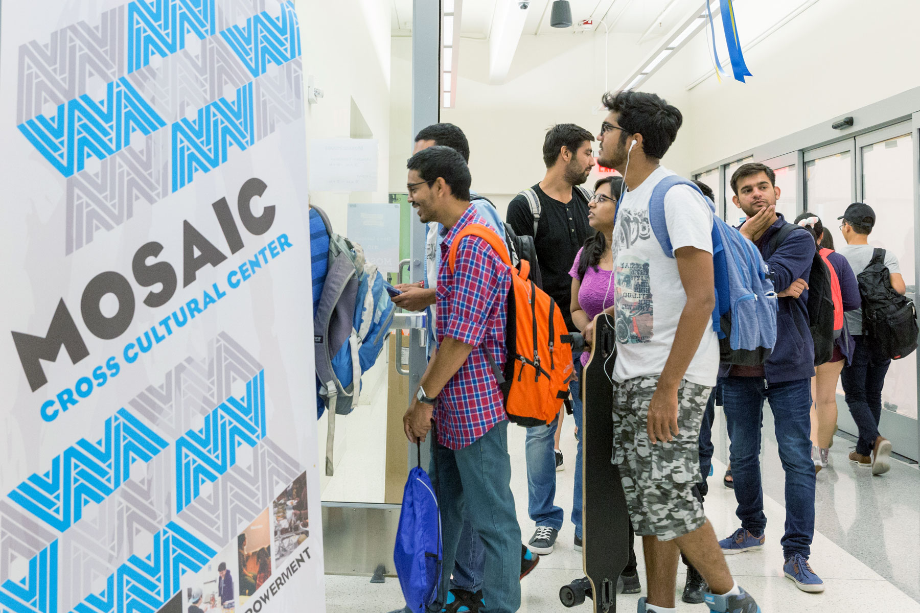 Students entering the MOSAIC Cross Cultural Center at the Student Union.