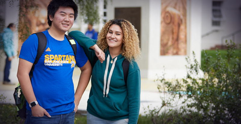 Two students casually standing