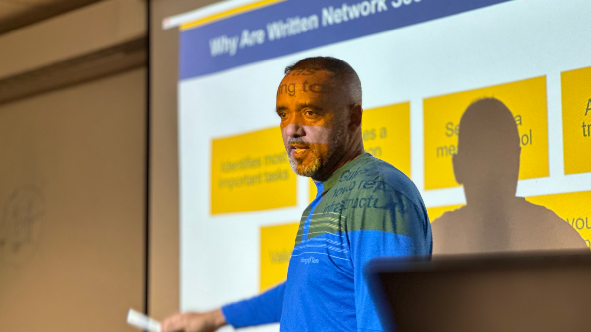 Professor Kidane Sengal teaching a master cybersecurity course.