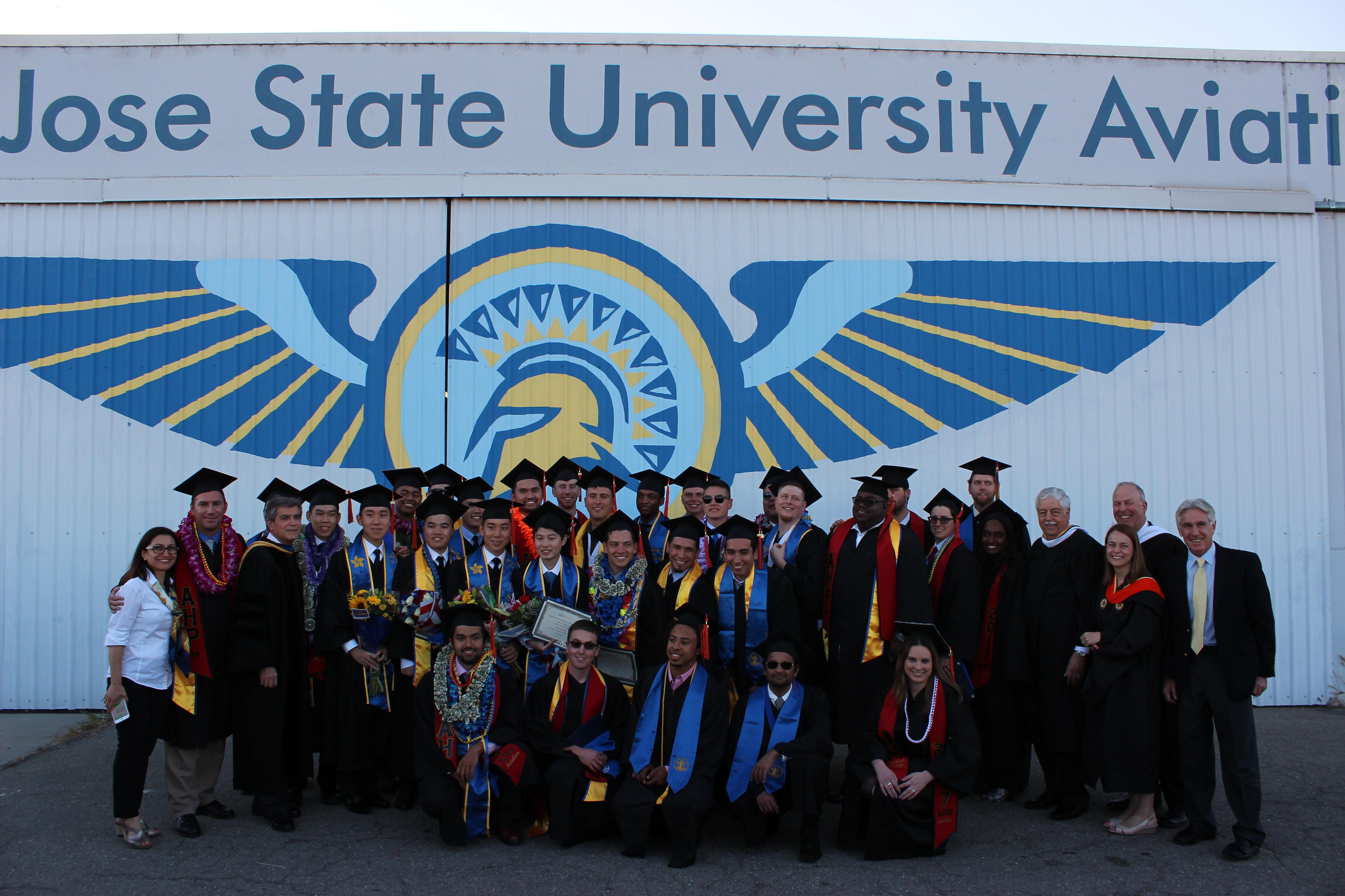 Large group of graduates in their cap and gowns.