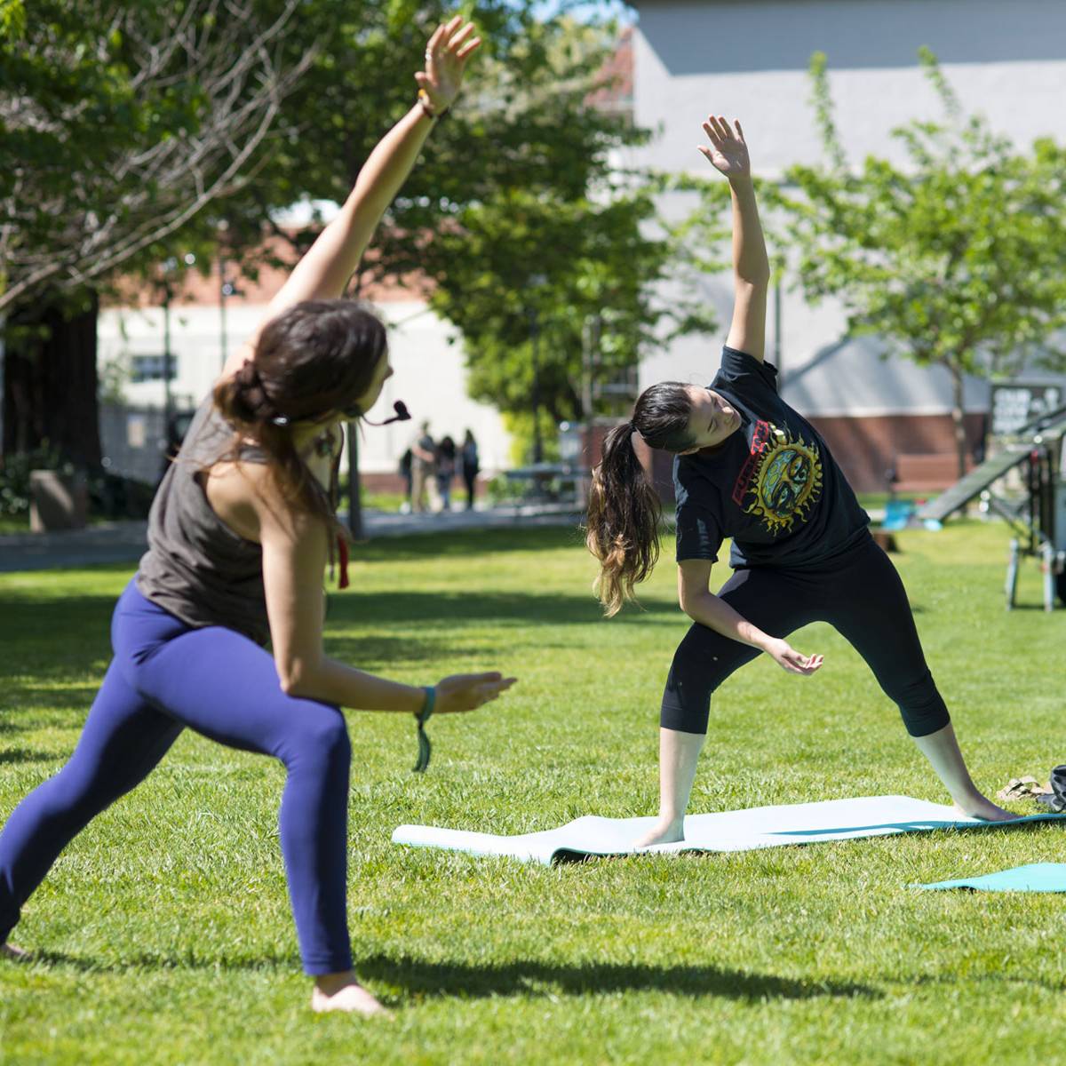 Two people doing yoga