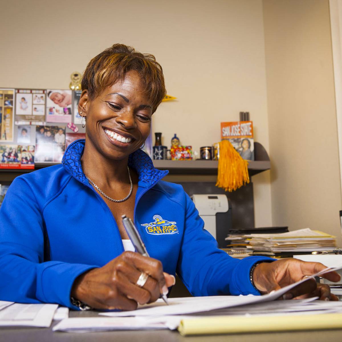 A woman signing papers