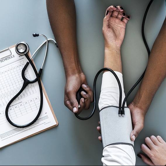 A person having their blood pressure measured