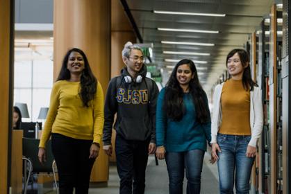 International students walk together through MLK library