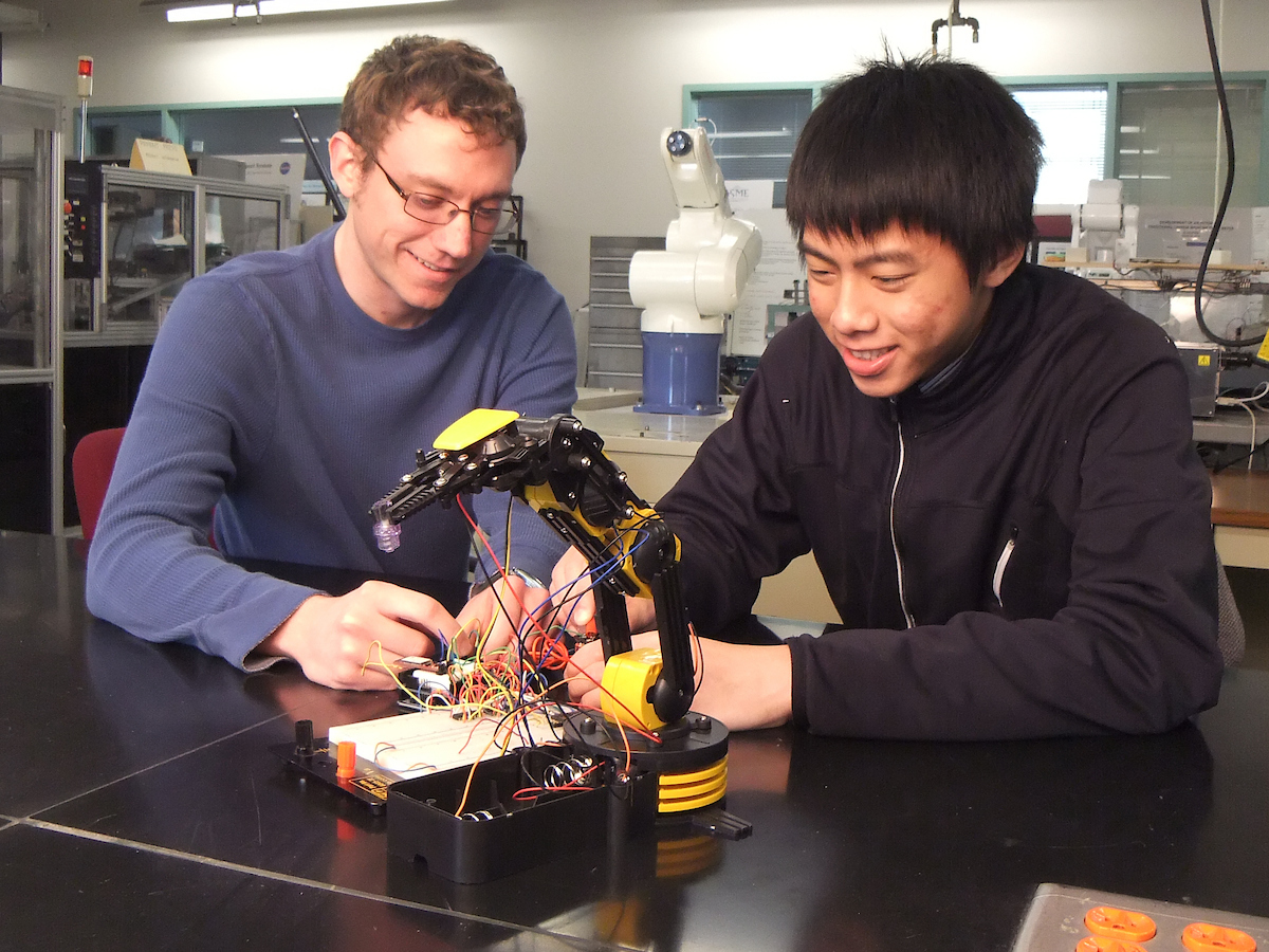 photo of two students in a lab