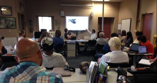 Students observing presentation on a whiteboard