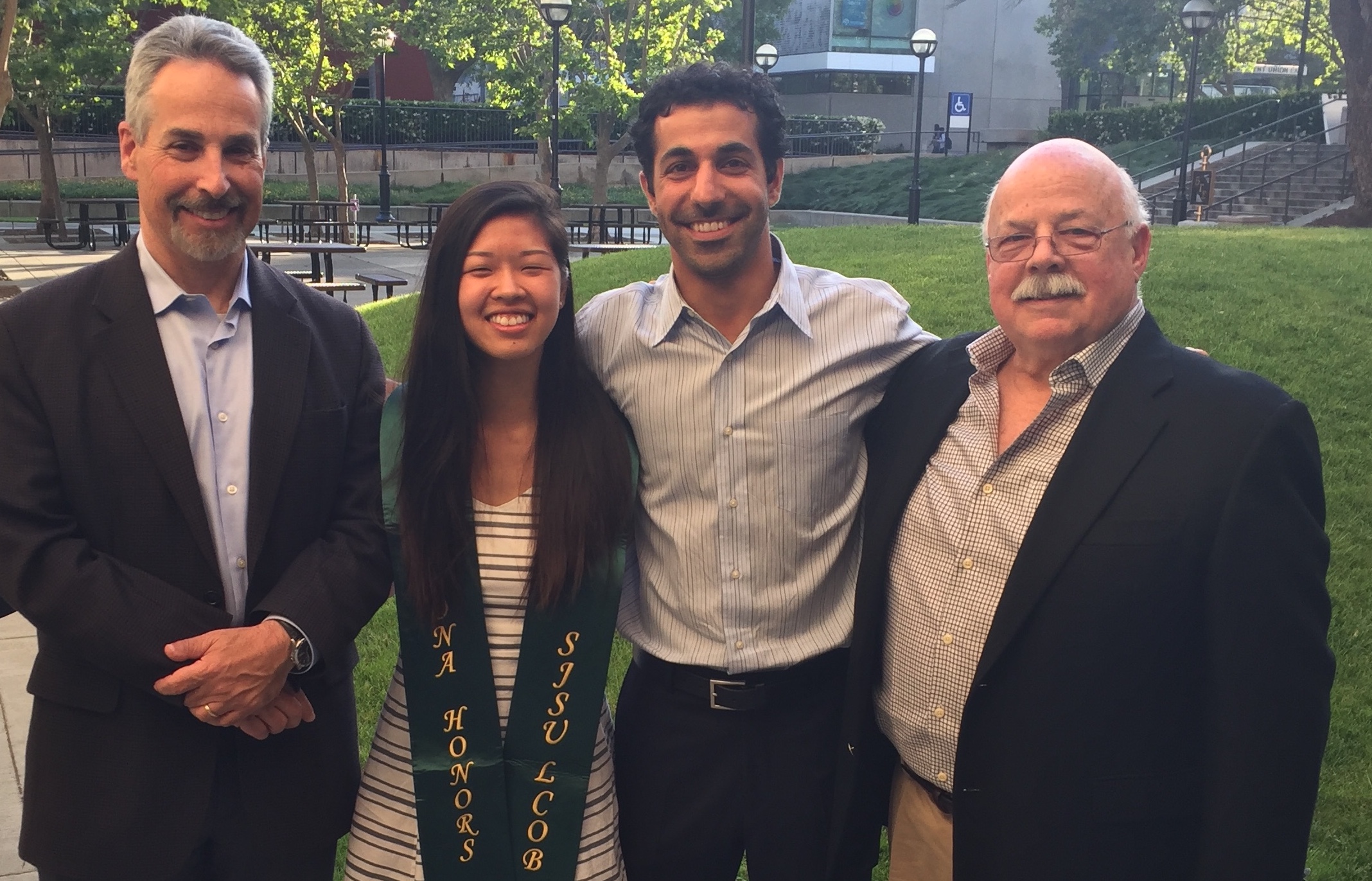 Honors Student with dean of LcoB and Professor Parineh