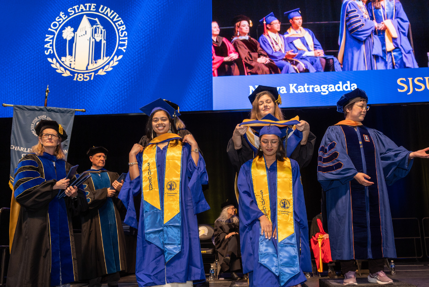 Graduate students being hooded