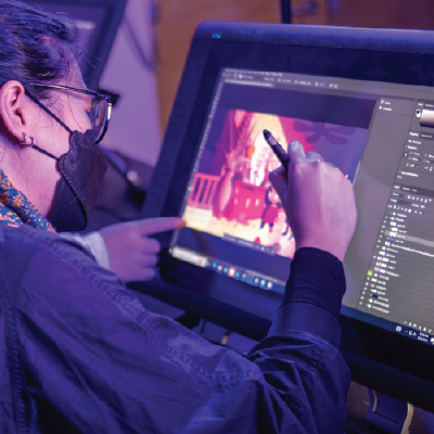 Student drawing on tablet
