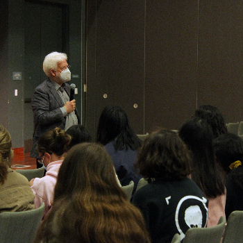 Man in front of students