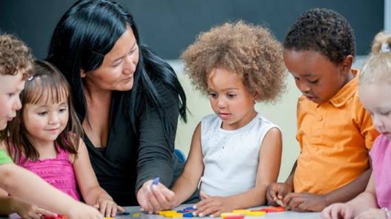 Teacher working with students