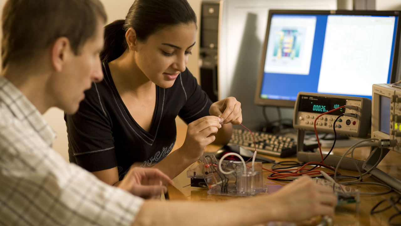 Electrical Engineering student working with professor