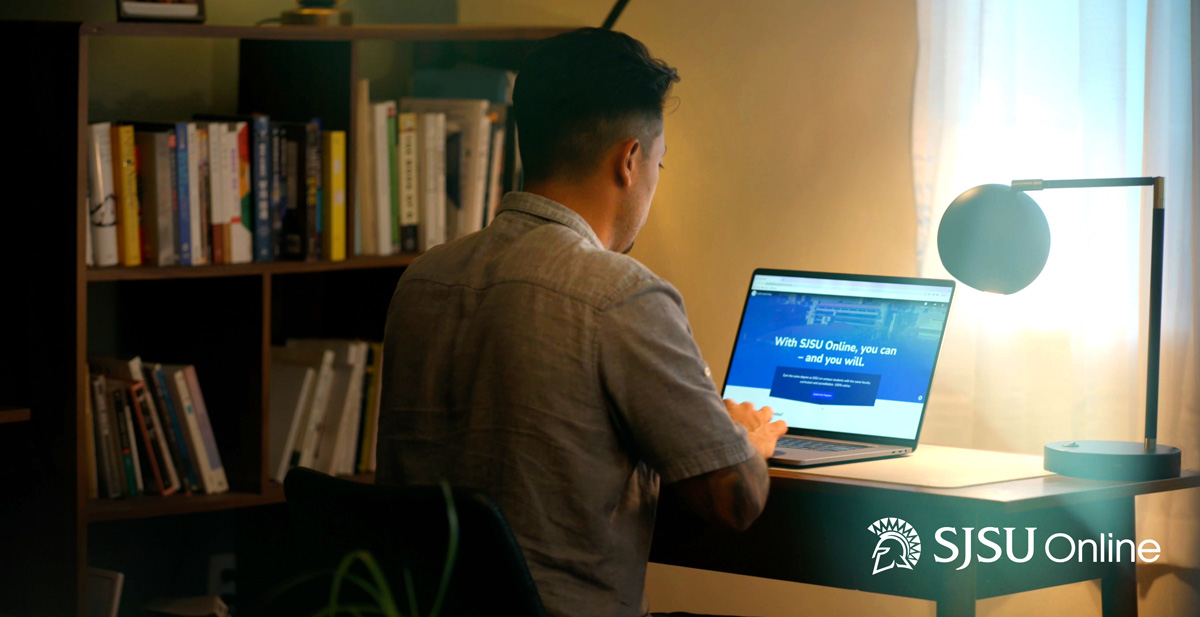 A student studying on their computer at home.