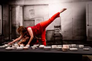 Revolution is a Dinner Party, Photo of two dancers at dinner table.