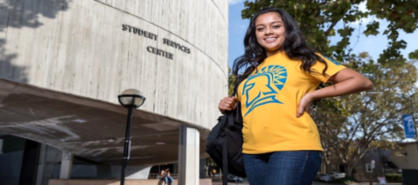 Student in front of the Student Services Center.