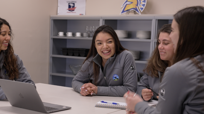 Hospitality students working together at a table