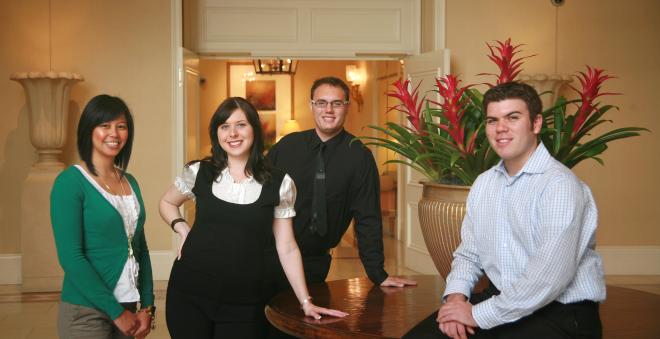 Students dressed professionally in hotel lobby