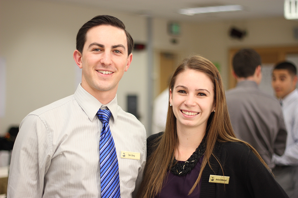 Male and female students smiling 