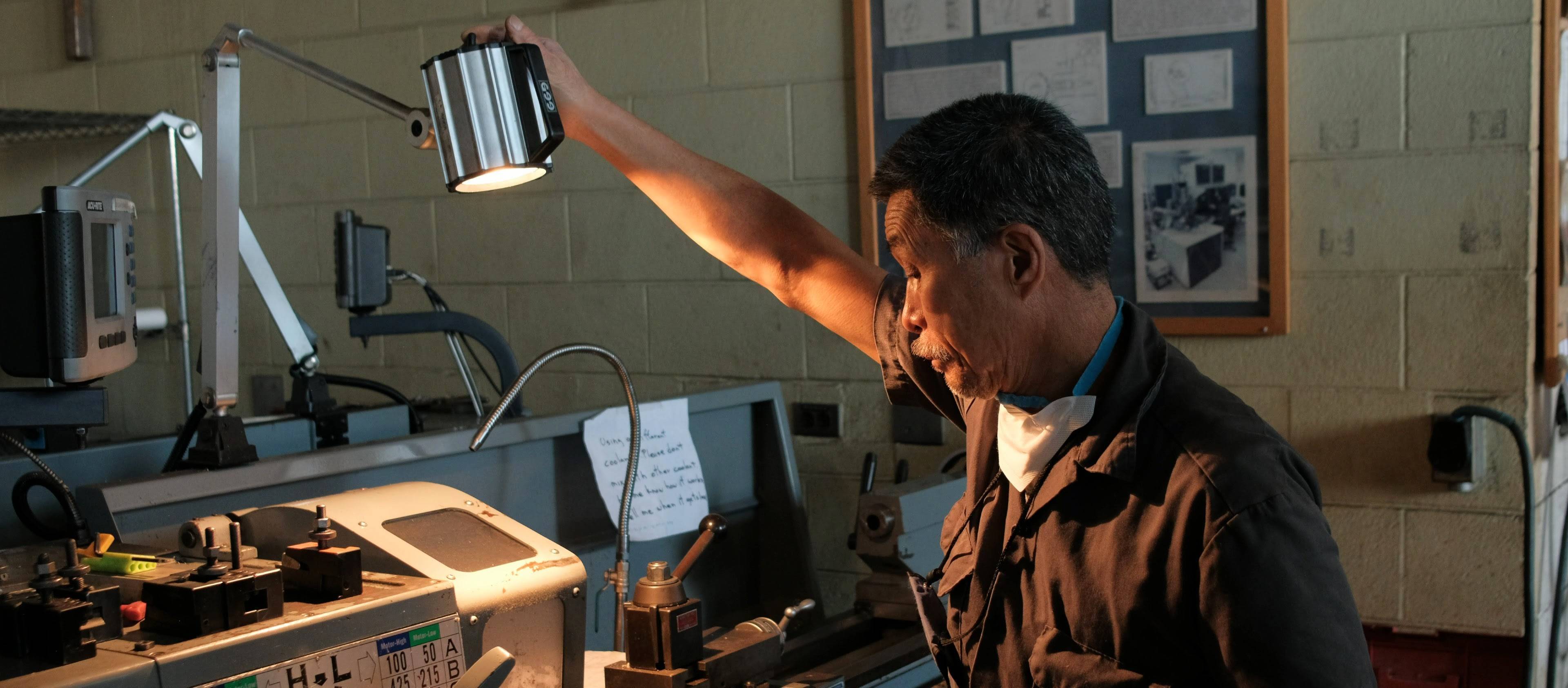 Roger, ME Department Technician, turning on the lathe's work lamp