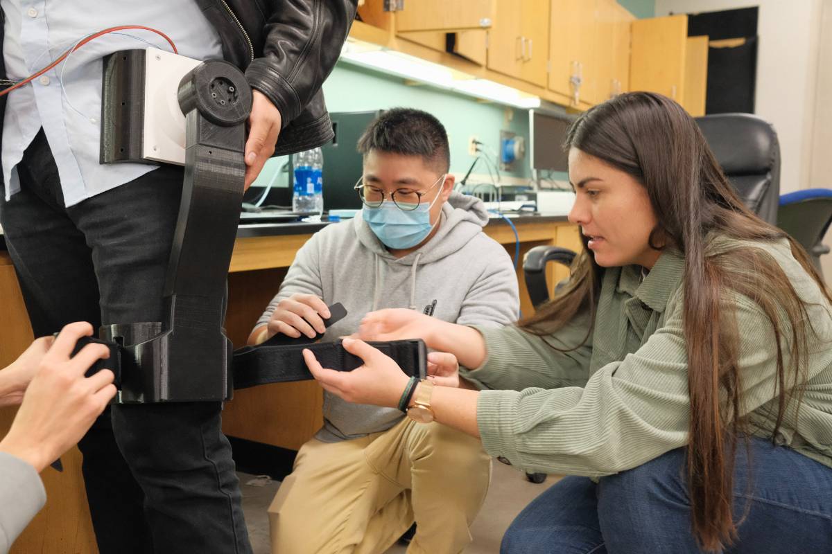 Students working on an exoskeleton prototype