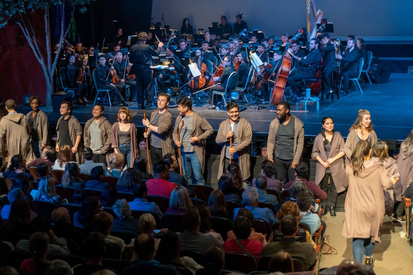 SJSU Opera Theatre group performs on stage to an audience.