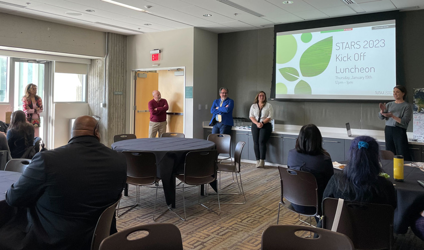 Office of Sustainability giving a presentation in a conferenece room.