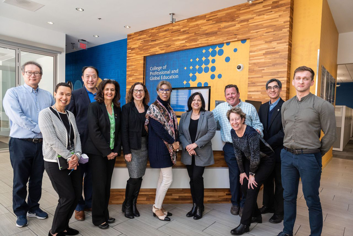 The president posing with CPGE staff and administrators.