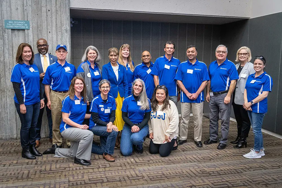 President Teniente posing with Family Advisory Board members.