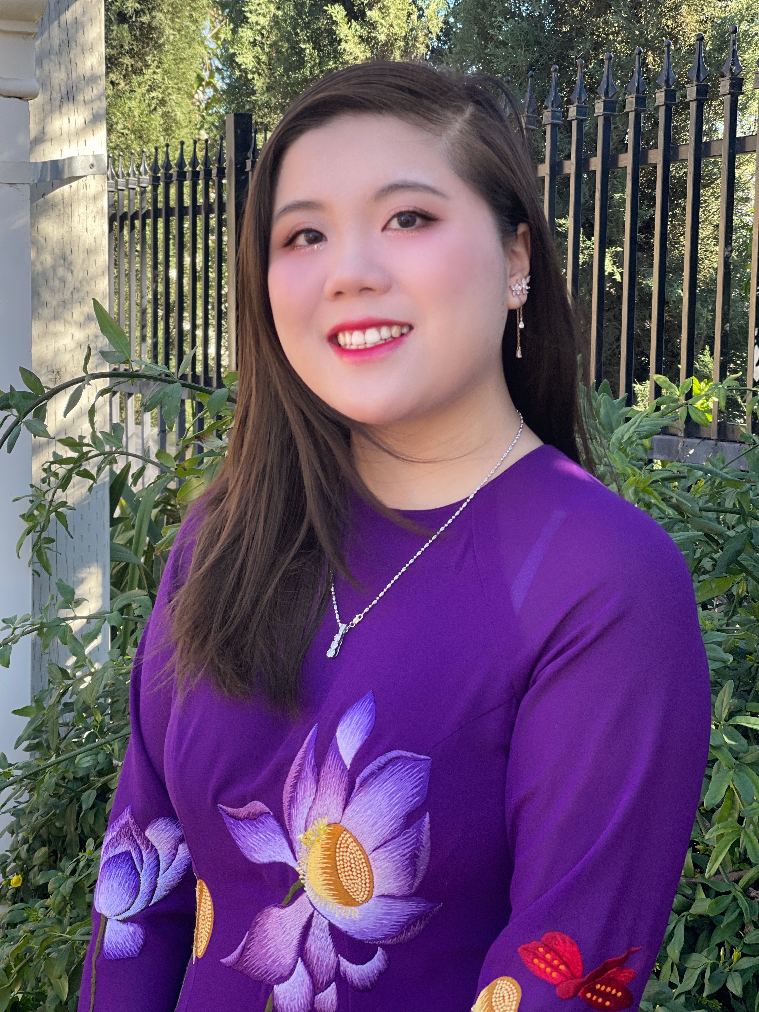 Asian women in twenties wearing a tradtional Vietnamese dress