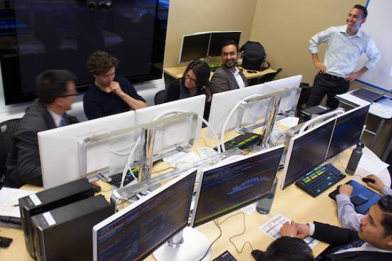 people talk and laugh in computer lab, bird's-eye view