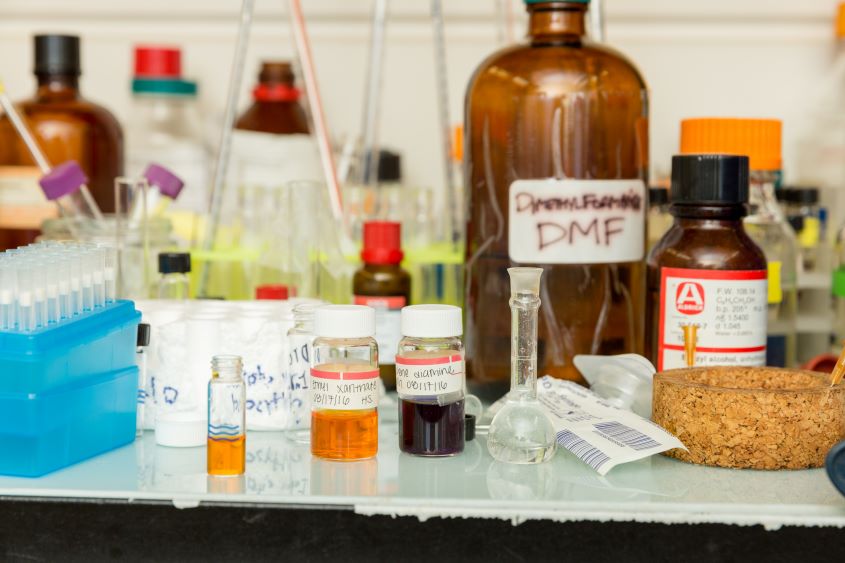 Containers of chemicals on top of a table.