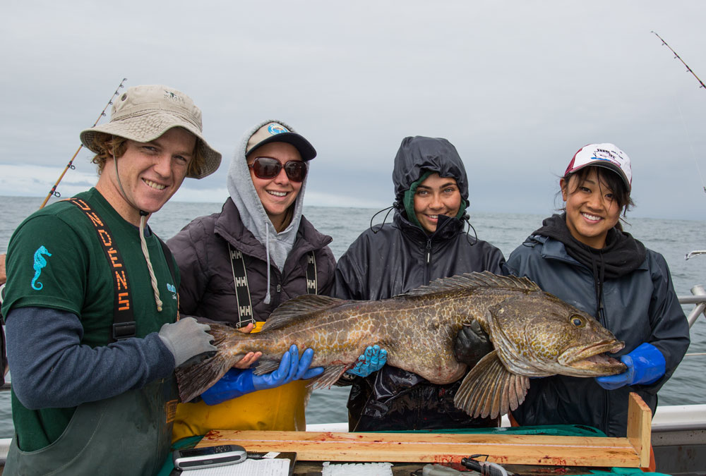 Students with large ling cod