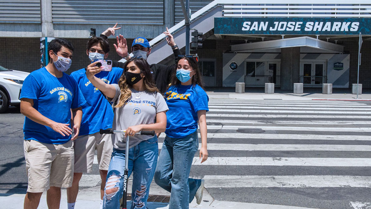 Students taking a photo at the Shark Tank in the SAP center.