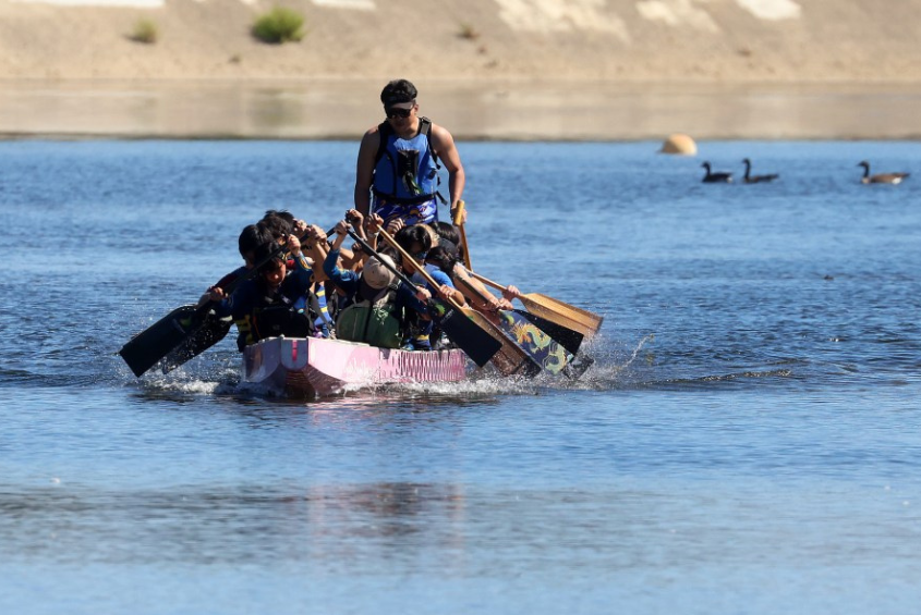 South Bay Dragon Boat team boating on a body of water.