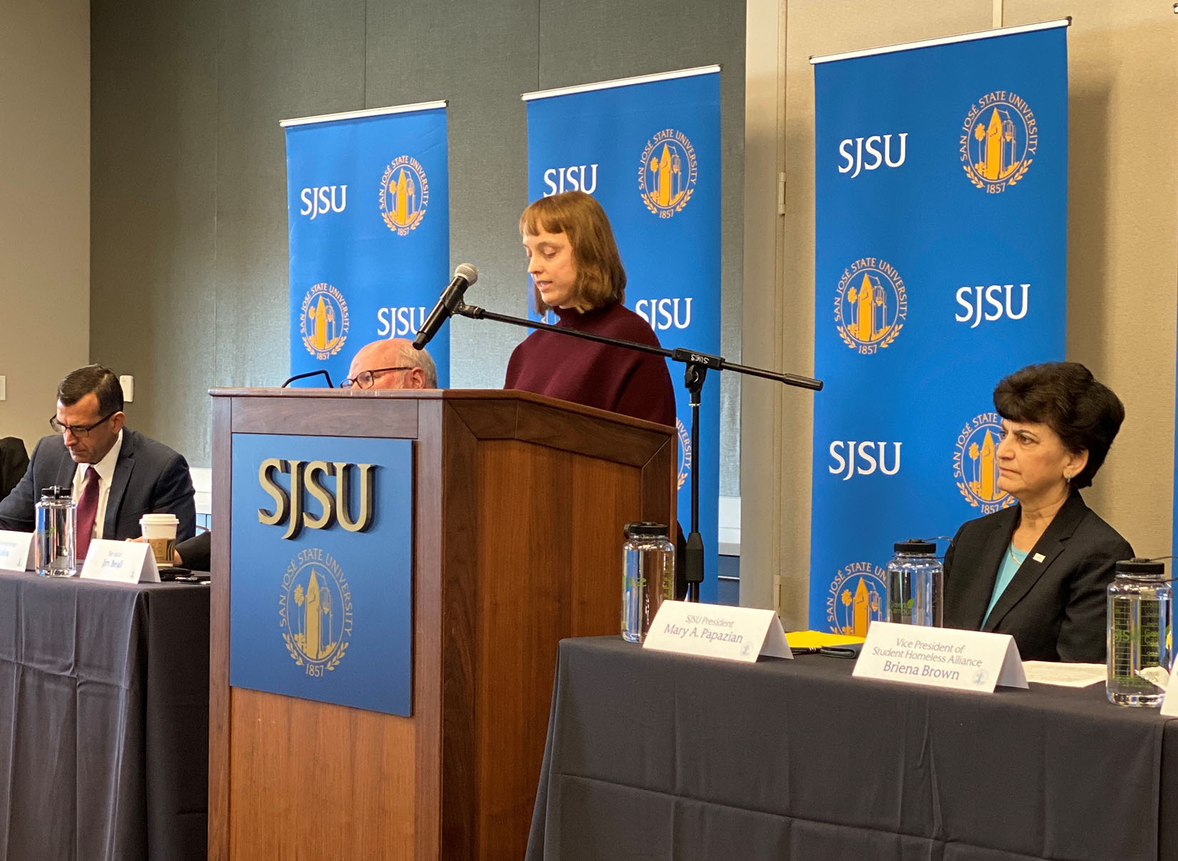 Staff Council chair speaking at a podium