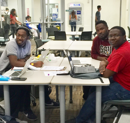 Group of students working on laptops at the AABSSC