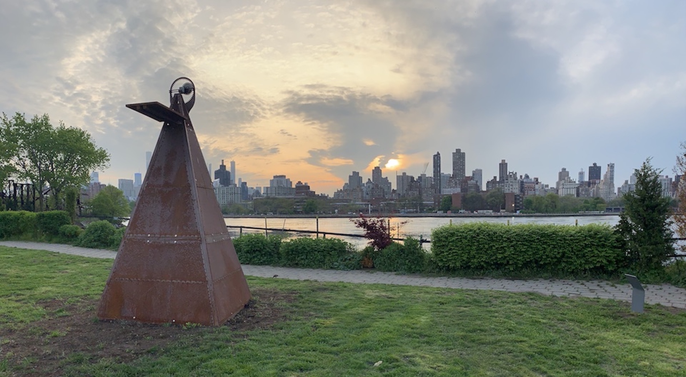 Beatriz Cortez, Tzolk'in I, 2018. Steel, motor, battery, timer, solar panel, acrylic, and lacquer marker. 132 x 64.5 x 64.5 inches. Commissioned by Clockshop. Courtesy of the artist and Commonwealth and Council, Los Angeles. Photo Credit: Scott Lynch, Socrates Sculpture Park, Queens, NY.