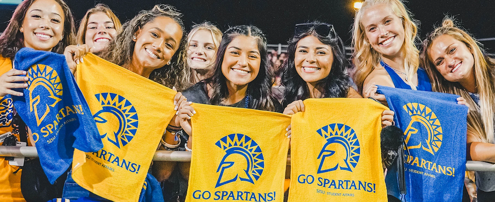 female students at a football game