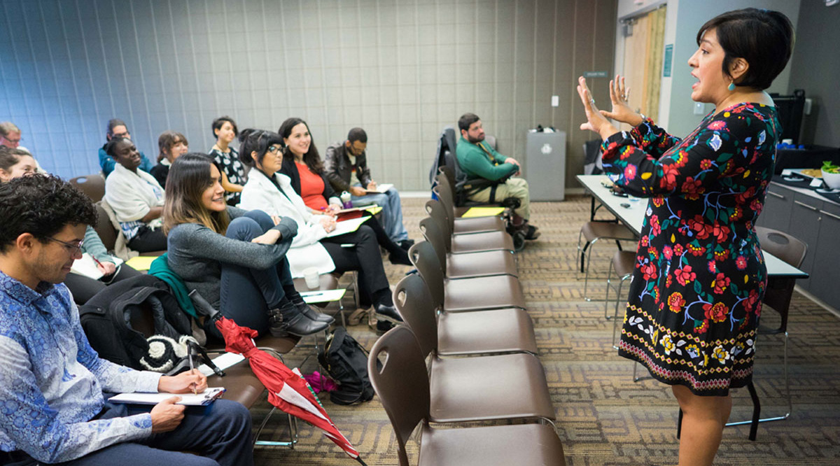 Magdalena Barrera speaking in front of an audience.