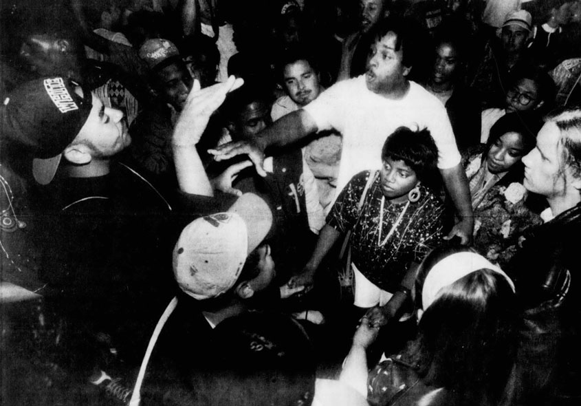 Black and white shot of a huddle of student protesters.