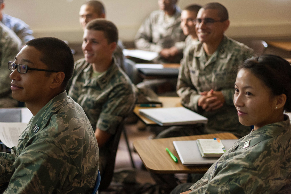 SJSU students in uniform sitting in a classroom.