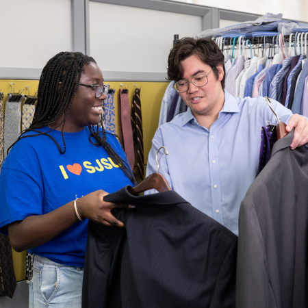 student being helped at the career closet